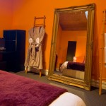 Gallery Suite Bedroom with Bathrobes and Giant Mirror